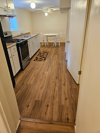 Kitchen with new flooring from bath room - Newly Updated Convenient 1 BR Apt Near Clairmont Campus
