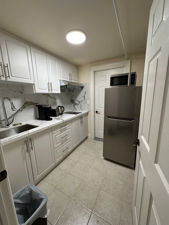 Kitchen - Newly furnished 2-bedroom basement, 6 min to Lawrence Station, private laundry, quiet area. House