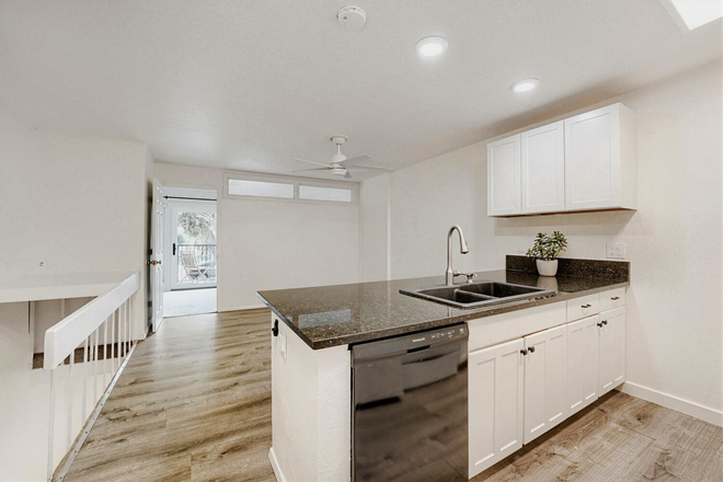 Kitchen and living room - 1200 College Townhomes Fall Pre-lease