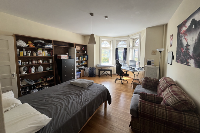 Bedroom - Row home room, natural light, full kitchen, furnished living room, finished basement
