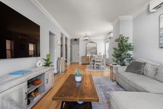 living/dining rooms - STUNNING 3 Bed/ 2 Bath with LAUNDRY IN UNIT & PARKING!! Avail. 9/1/26!!!