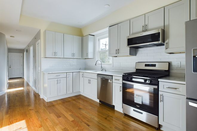 Kitchen - Modern 4BR/2BA: Central Air + In-Unit Laundry + Private Deck