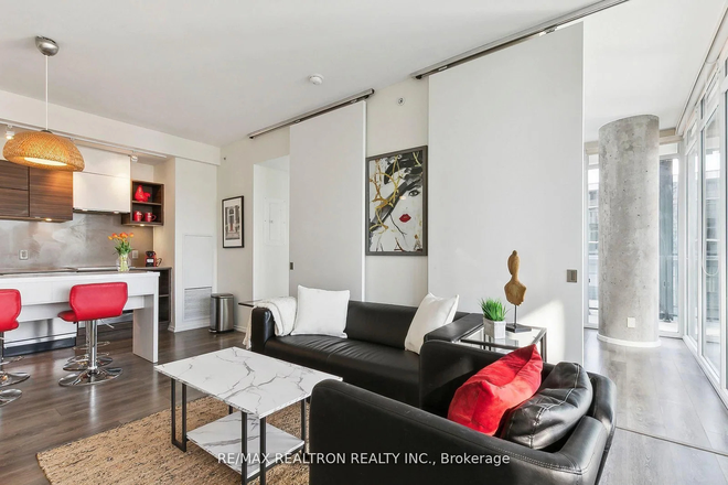 Living Room and Kitchen - 2-Bed Corner Condo | 1 Private Room 125 Peter St. 655sf + 300sf wrap balcony. Walk to U of T.