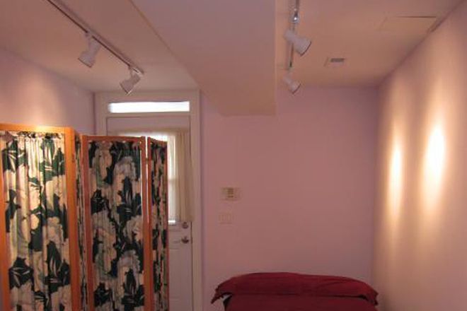 Bedroom & entrance facing west - Fully furnished all-inclusive one-bedroom basement suite with private laundry, close to downtown
