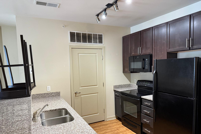 Kitchen and Washer/dryer room - Varsity Apartments UMD
