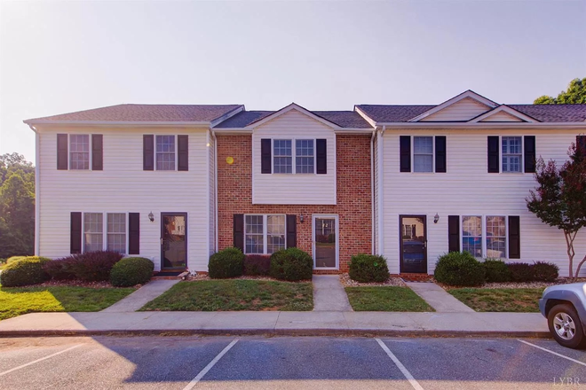 Front of unit with two assigned parking spots. - Sterling Park Apartments