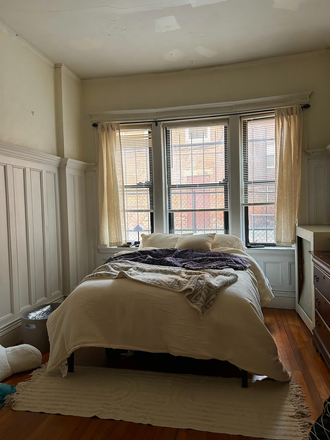 windows and bed opposite armoire in bedroom - 2-bedroom (or 1-bedroom sublet) spacious apartment, near green line Riverway stop