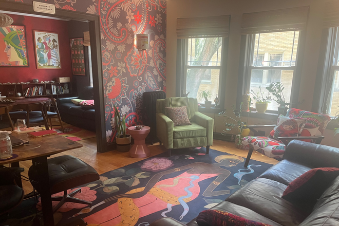 Living room - Art-Filled Furnished 1BR Retreat Near Northwestern and the Lake