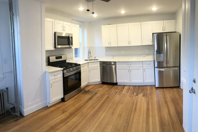 living - STUNNING 3 BED, HEAT/WATER INCLUDED WITH IN-UNIT LAUNDRY! NO BROKER FEE! 9/1/26!