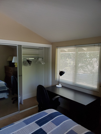 Bedroom desk, closet and window overlooking the side neighbor - Turtlerock Home - bike to UCI (Utilities, High Speed WiFi included)