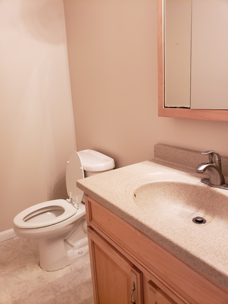 Half bath located at the lowest level with Family Room - ROCKRIDGE CONDOMINIUM 3-LEVEL TOWNHOUSE $1975/MONTH