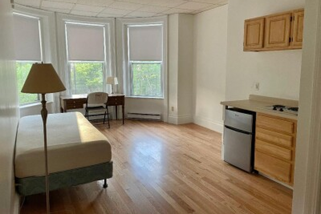 Visit hubrealtyproperties.com - Lovely studio with 3 big windows facing Beacon St, on the Green Line T Apartments
