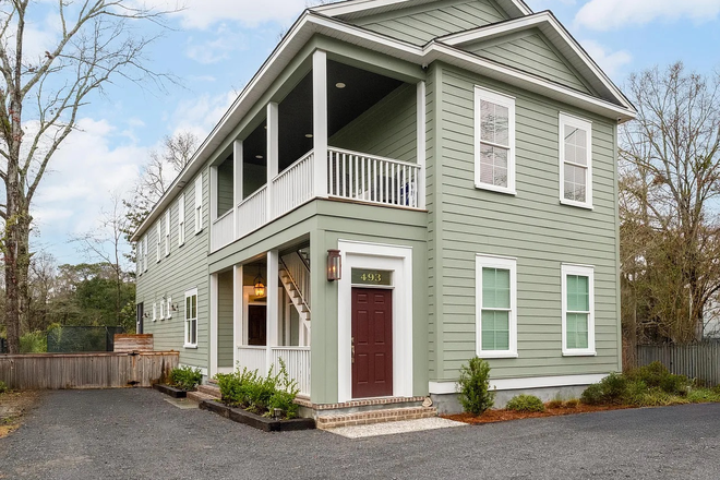 Your apartment enters in the private red door and personal staircase, top porch is yours! - Immaculate and Inviting - Unwind and move in ready! QUICK 10-15 minutes to MUSC downtown