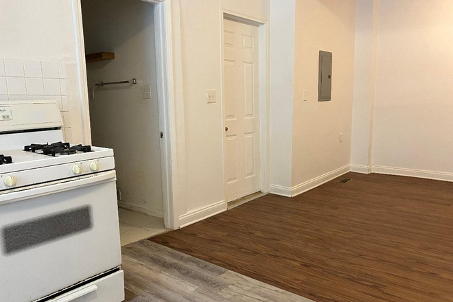Partial view of kitchen and entrance door - 3bdrm/1bath - no app fees! Apartments