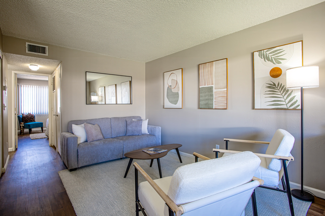 Living Room - 3 Bedroom Apartment...Now As LOW AS $415 per Room! CALL TODAY!