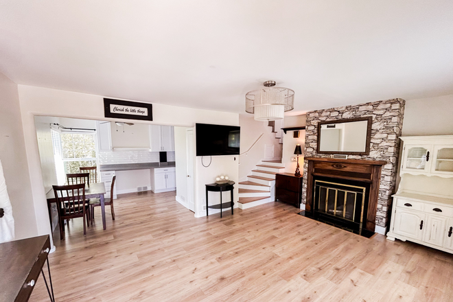Living room with TV & Fireplace - Renovated 3BR/1BA in Desirable Sugar House 4-Plex