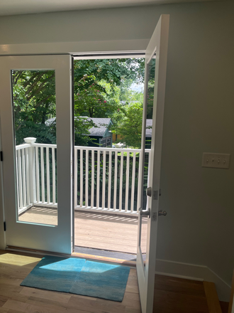 French doors to balcony and view of Koi Pond - New Construction Studio-Garage Apartment Less Than One Mile from VU Campus