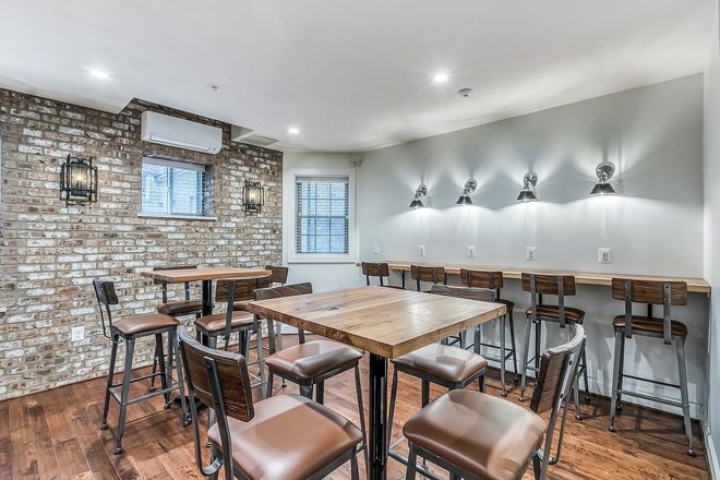 Lounge Area - 🏡 $1,000 Move-In Credit • Largest 1BR at University West • 2-Min Walk to JHU Apartments