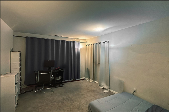 Living room that has been converted as a room - Brandywine Apartments