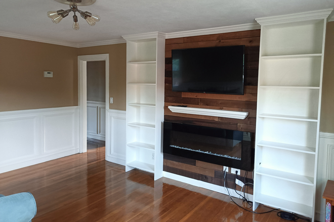 Living Room Bookshelves, Flat screen TV & Fireplace - TUFTS - Available September 1, 2026 - NO BROKER FEES - Medford on the Somerville line Apartments