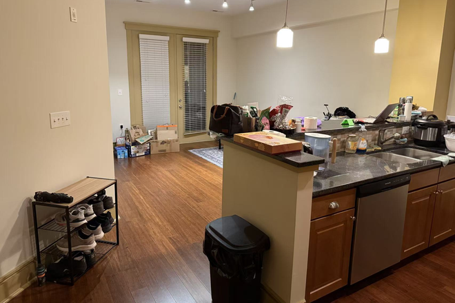 kitchen and guest room - Trinity Commons Apartments