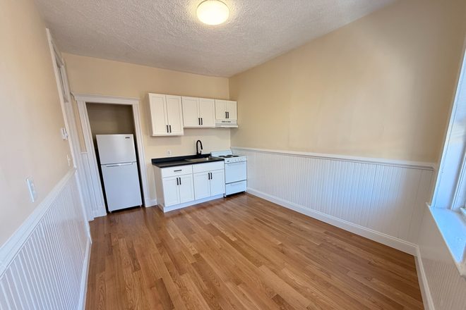 Visit hubrealtyproperties.com - Top floor roomy 2 bedroom with brand new kitchen and bathroom, new hardwood floors Apartments