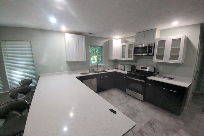 Brand new chefs kitchen - Gas stove, GE Cafe Micro, quartz, Dishwasher, disposal, all new cabinets, sink, faucet, refrigerator, flooring - Just Outside 1-mile (drive or walk to UNCW): Beautiful 100% renovated home - One Bedroom to rent