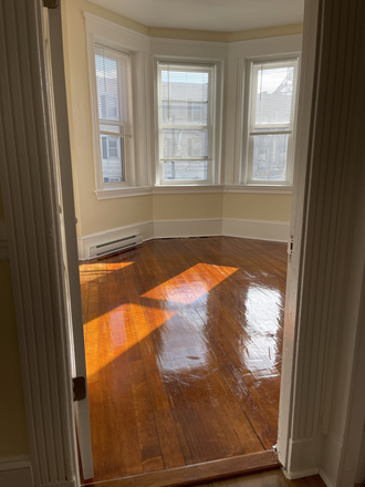 Visit hubrealtyproperties.com - Mission Hill, sunny front facing 2 bedroom split on Green line T