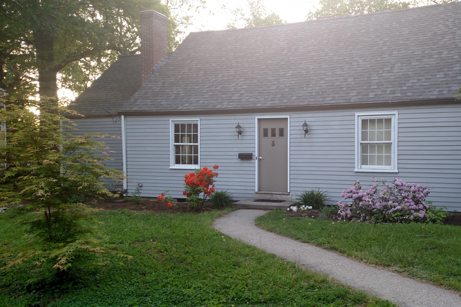 Front of house - House with yard/patio/laundry 2 blocks from UMass, 3 rooms available