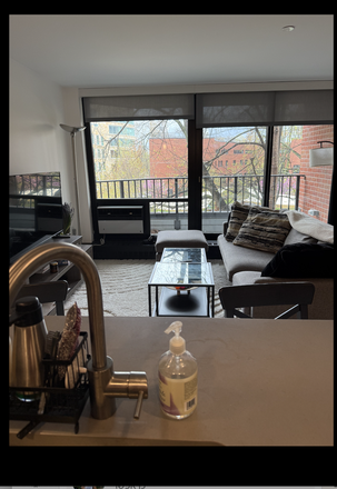 Living room and balcony - 2B2B SFP apartment on HBS campus