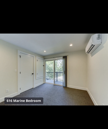 Bedroom with balcony - 616 Marine Street Apartments