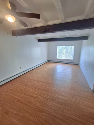 Living Room - Easy 20 Minute Commute! HEAT & HOT WATER INCLUDED! Apartments