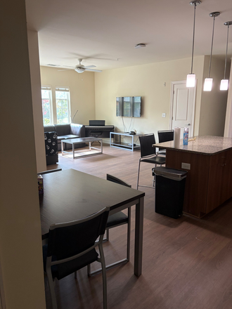 Kitchen and Common Space - University Crossings Apartments