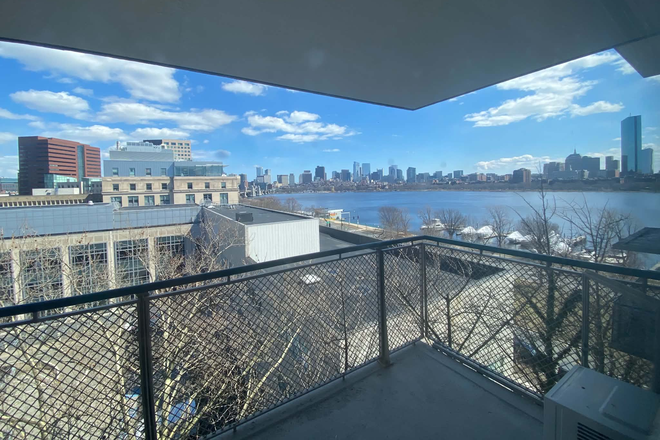 Private balcony with Charles River and Boston skyline views - Furnished 2BR at 100 Memorial – Balcony & Charles River Views