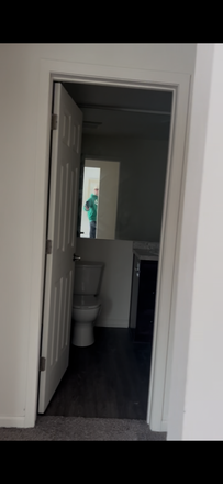All photos are screenshots from a recorded video walkthrough of the apartment. This is a hallway shot of the batr - BerryTree