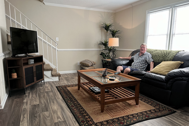 The main living room featuring my grandpa - District at Tar River Apartments