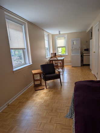Formal chair, parquet flooring - Simple studio apt. Indoor bicycle parking. Location to everything Philly has to offer.
