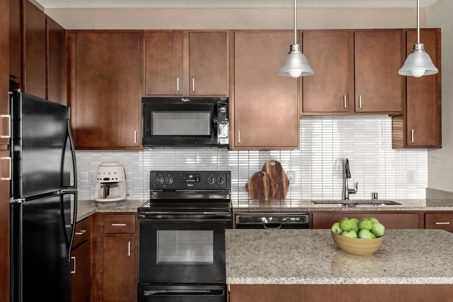 Full Kitchen with Stove, Oven, Dishwasher, Microwave, & Fridge/Freezer - 1-Bedroom Accessible Apartment with Fitness Center & Pool Amenities