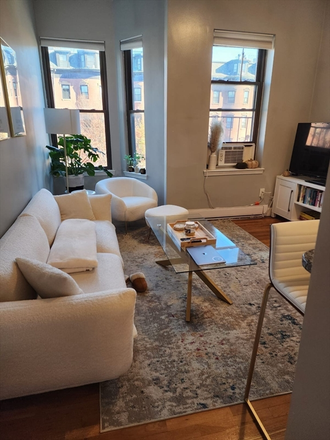 Living - Modern 3-Bedroom Condo on Mass. Ave. South End | W/D In-Unit | Private Balcony