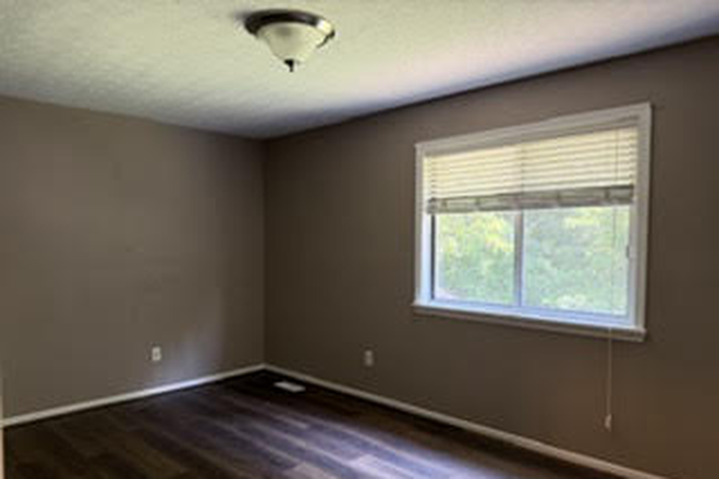 Primary bedroom - Diamond in the rough! 3 BR two story duplex w attached Garage and Yard Duplex