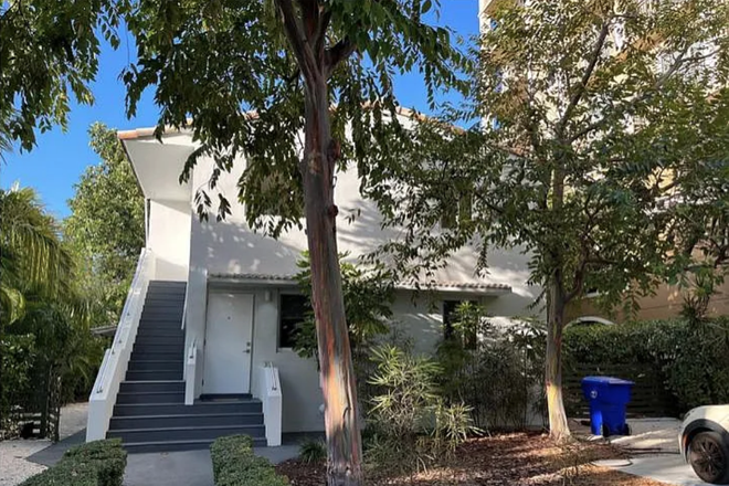 view of the entrance duplex - apartment is the upstairs unit - Bright and Charming Two-Bedroom Apartment in a Tranquil Natural Setting