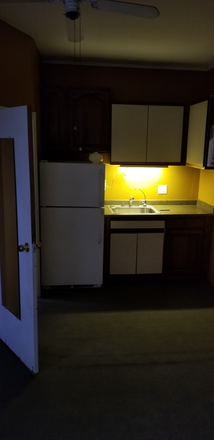 Sink. Fridge. Cabinets. Bathroom door. - Studio near Bellmore Village and LIRR. Beautiful Apartment