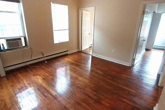 Visit hubrealtyproperties.com - Mission Hill, nice two bedroom with living room Apartments