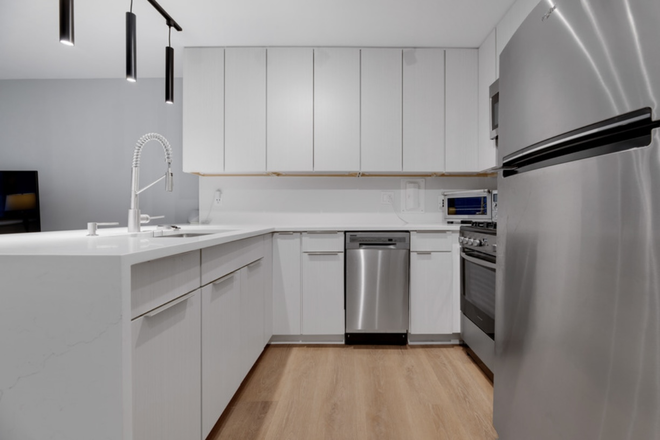 Kitchen - lots of cabinet space - Charming fully renovated, FURNISHED, and thoughtfully designed studio - feels like a one-bedroom Condo