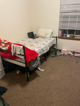 Bedroom. Please ignore the mess. - Apt 17, Granite Management