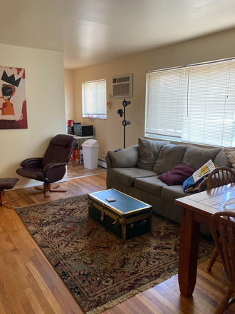 Living Room - Enjoy living close to campus. 3 blocks from CCM and campus amenities. Available 8/1/26.