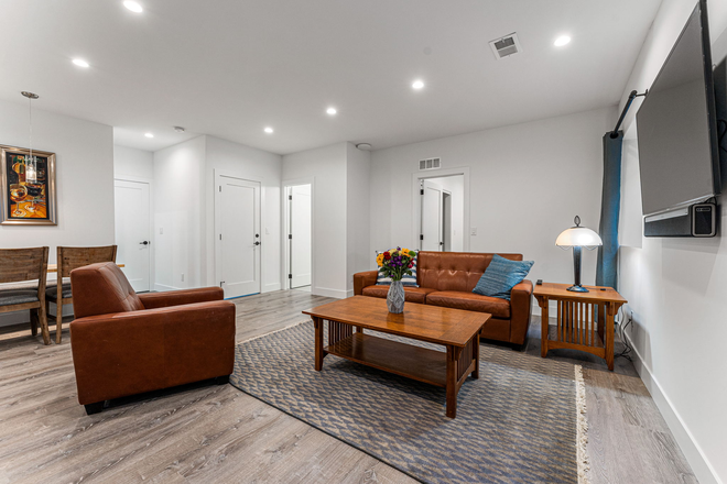 Living Room - Fully Furn. 2 bed 1 Bath Basement Apartment w/Garage Space $2,600 per Mon. Incl. all Util