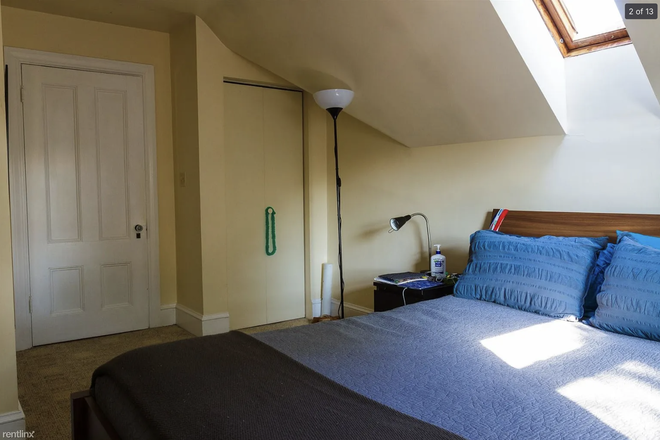 Bedroom with skylight and walk in closet - Porter Square Apartments