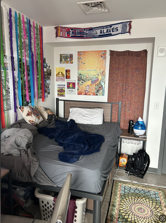 Bed space with full size twin bed, drawers underneath the bed, nightstand and desk/chair included - Lightview Apartments