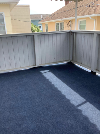 Outside covered deck - EXPERIENCE THE TRANQUILITY OF BEACH SIDE LIVING Apartments